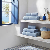 Juego de 12 toallas de lavabo color azul de 100x50 cm de 550gr/m²