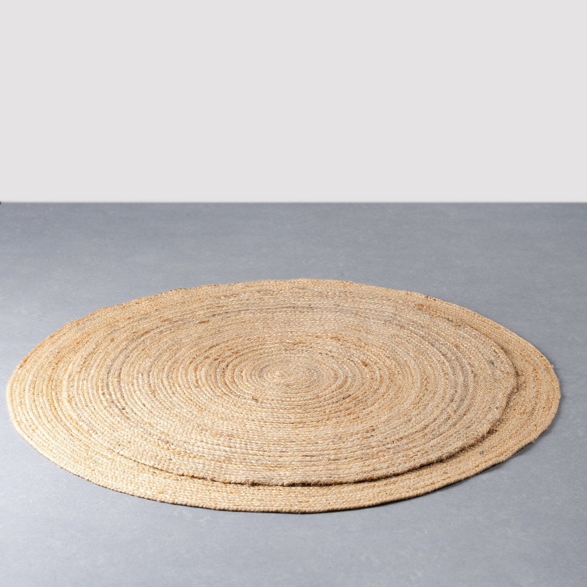Alfombra redonda trenzada de yute natural doble costura de 90 cm